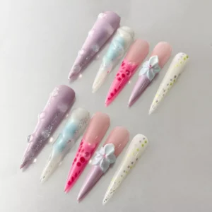 Close-up of 3D flower on pastel press-on nail with glossy pink and green base