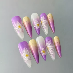 Gradient purple and white press-on nails with sculptural floral details