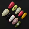 3D fruit press-on nails with glossy finish and colorful sculpted fruit designs – front set display