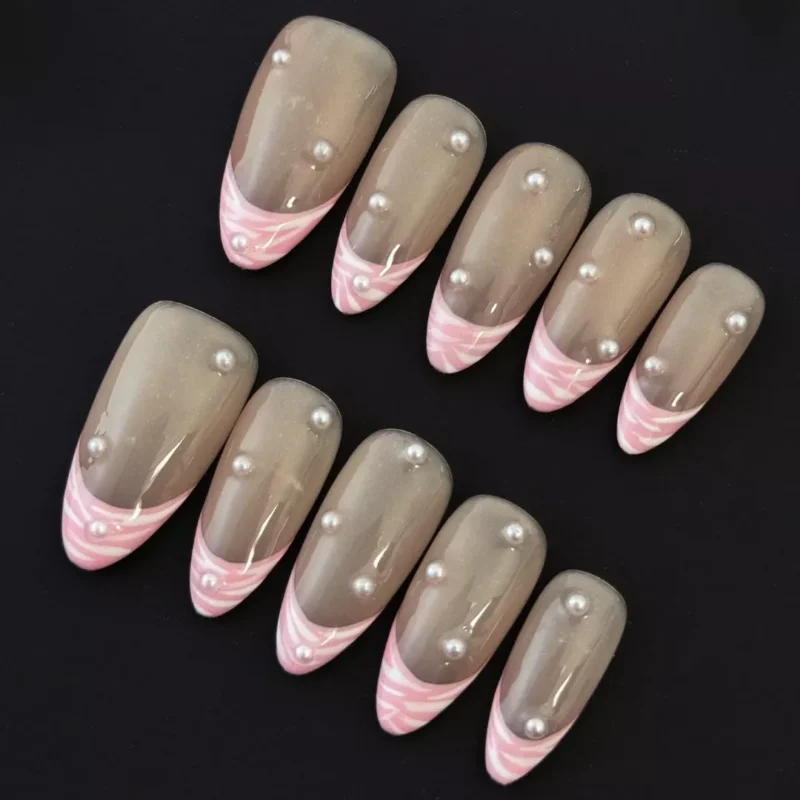 Side angle of Pearl Pink Press-On Nails featuring pearl embellishments