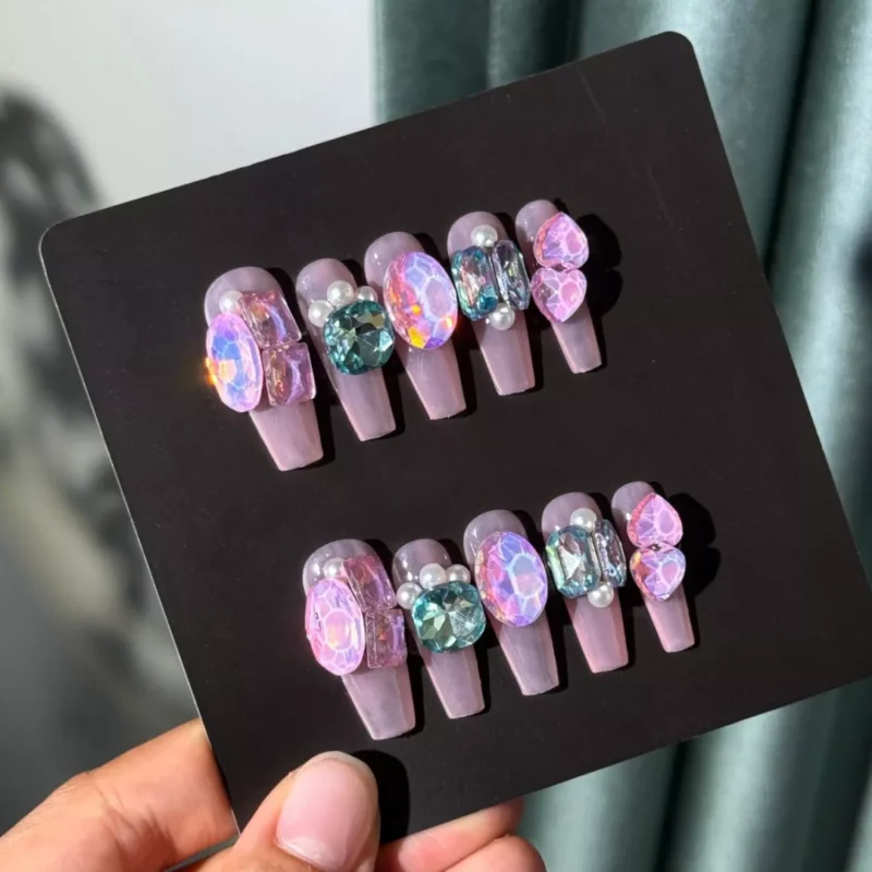 Blush pink press-on nails with 3D glitter and pearl decor - styled set