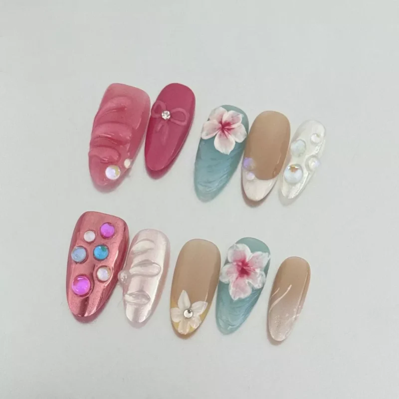 3D wave press-on nails with pastel gradients and tropical flowers