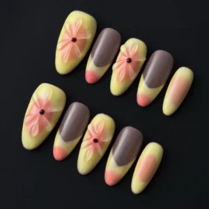 3D Yellow Press-On Nails with floral relief and soft gradient finish – front view