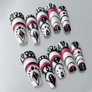 Close-up of red and black patterned press-on nail with tribal and geometric line art