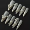 Abstract Silver Chrome Press-On Nails with sculpted 3D metal details on sheer base