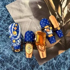 Luxury press-on nail set with gold metal foil and floral blue print