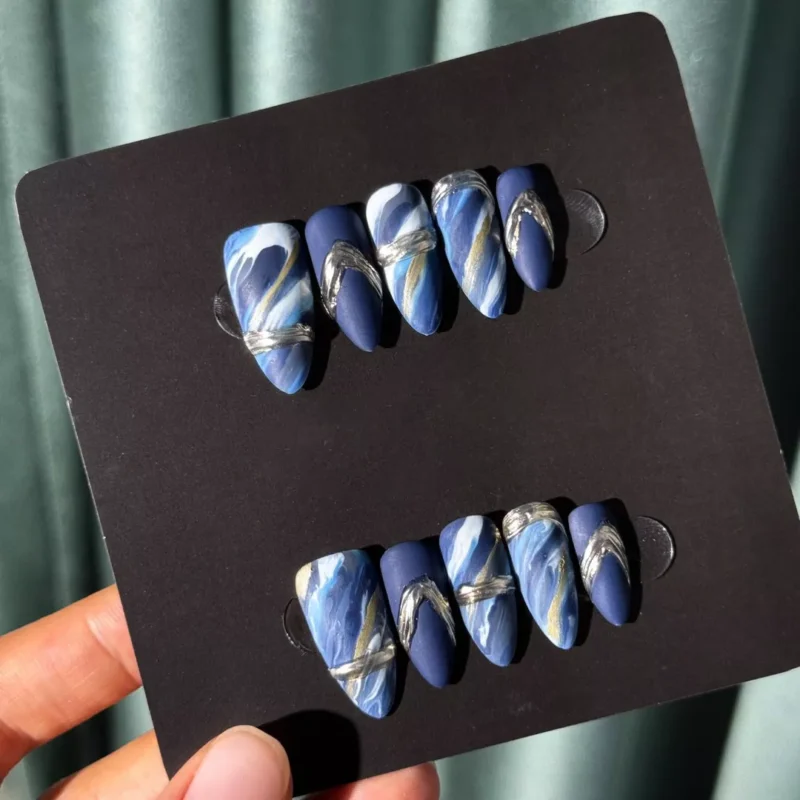Set of Matte Blue Marble Press-On Nails under natural light