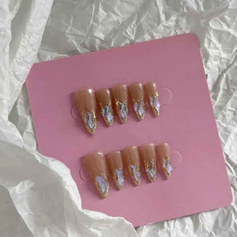 Artistic shot of Iridescent French Press-On Nails showing nude base and holographic tips