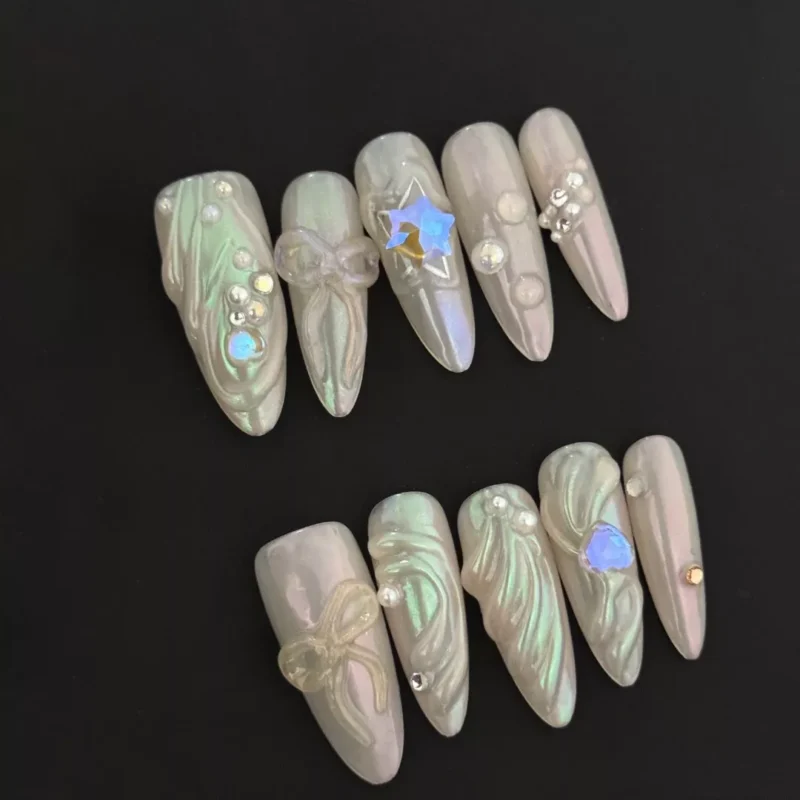 Aurora Pearl Press-On Nails with 3D bows and star gems in iridescent white
