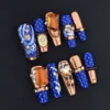 Baroque Charm Press-On Nails with blue print and bronze 3D embellishments