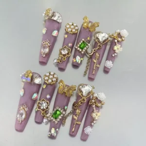 Lavender base Baroque Style Nails featuring heart crystals, roses, and vintage gold key charms
