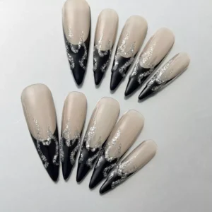 Black French edge nails with silver glitter flame tips – nude background base