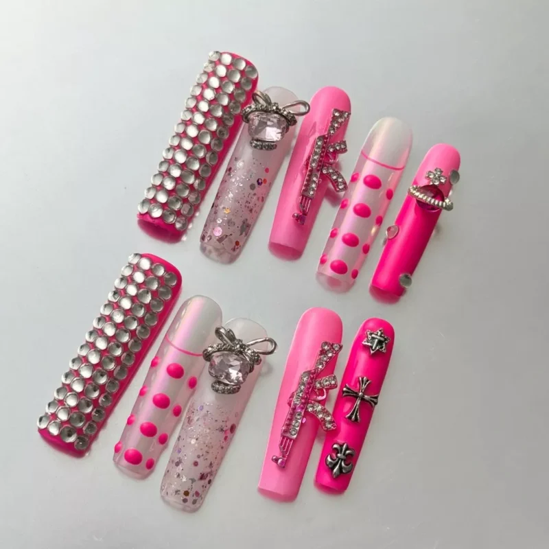 Pink press-on nails with glitter, 3D crystals, and Y2K punk accessories
