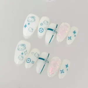 Close-up of blue kitty cartoon nails on glossy white press-on set