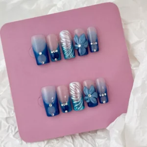 Blue Ombre Press-On Nails featuring pearl gem accents – close focus