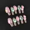 Blush Pink Gem Press-On Nails with iridescent crystal and pearl accents - front view