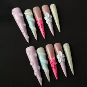 Bubble bead accent on pastel stiletto fake nail with dot candy texture