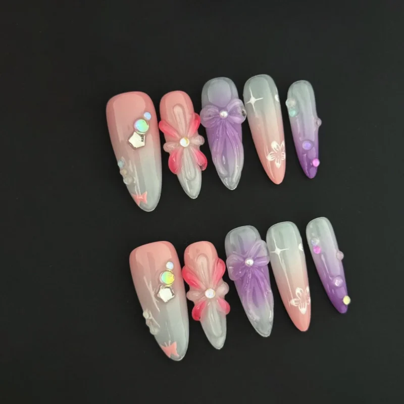 Candy Bloom Press-On Nails with pink and purple 3D floral accents and pastel rhinestones