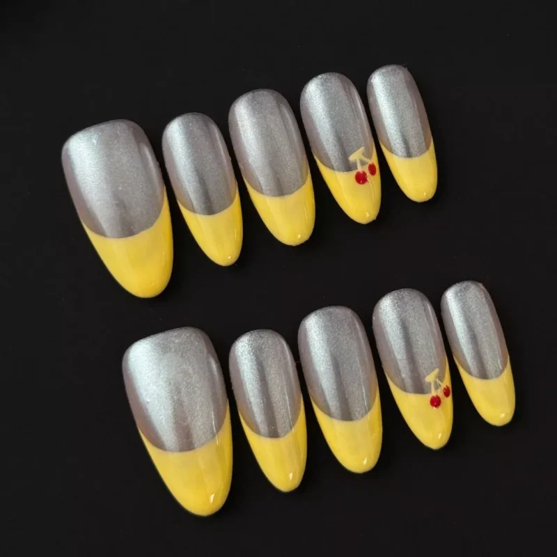 Cherry Accent Press-On Nails in chrome and yellow tones - styled layout