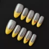 Chrome French Press-On Nails with yellow tips and cherry accents - front view