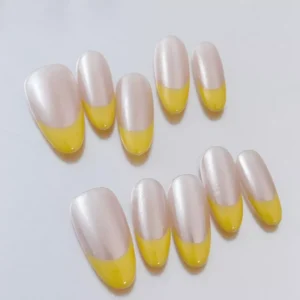Side view showing Yellow Tip Press-On Nails with subtle chrome finish