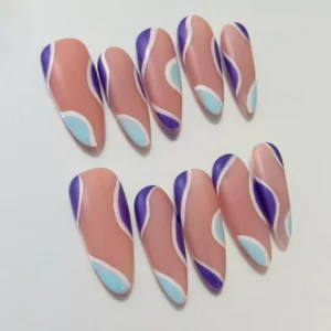 Close-up of pastel swirl design on nude base press-on nails