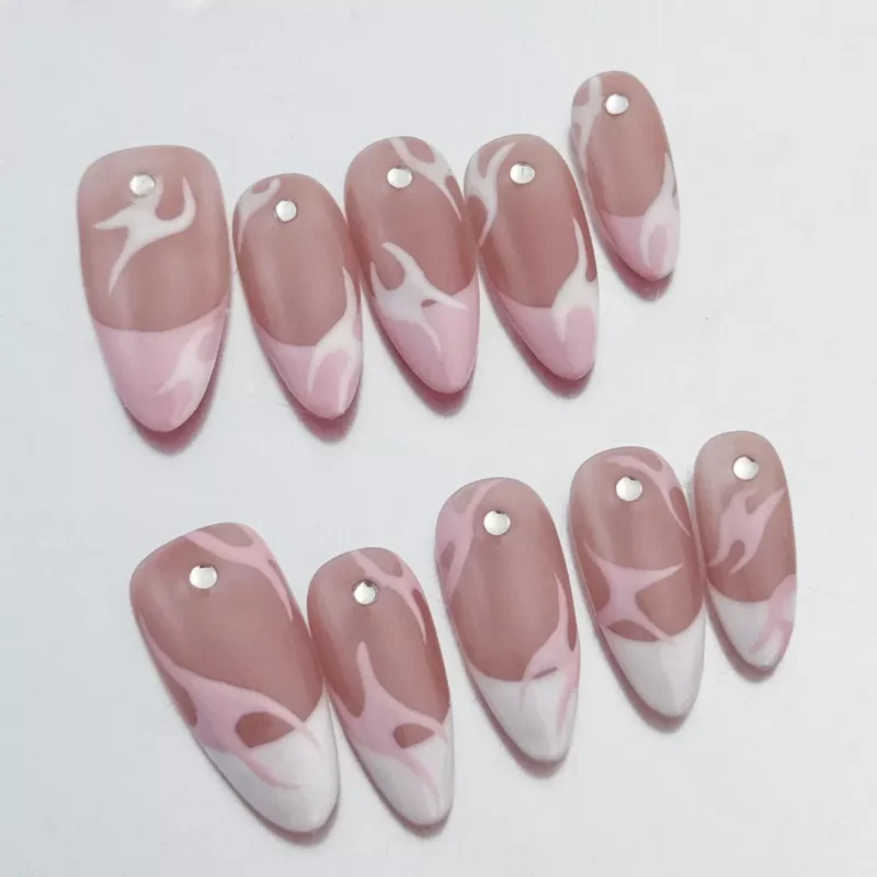 Close-up of Pink Flame French Press-On Nails featuring glossy pink and white flames with rhinestones