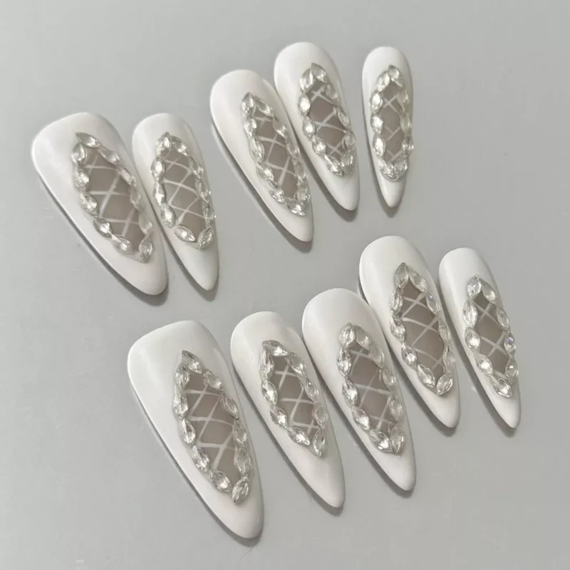Close-up of White Lattice Press-On Nails highlighting diamond rhinestone cutouts