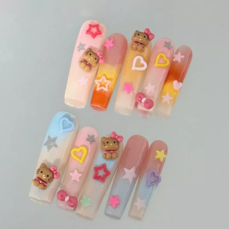 Close-up of Long Square Pastel Press-On Nails with Heart & Bow Embellishments