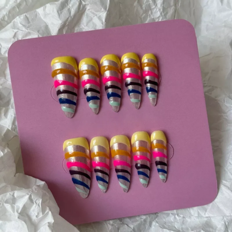 Press-on nails with multicolor spiral stripes and long pointed tips