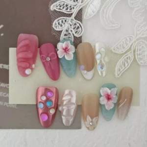 Crystal shell press-on nails with beach-inspired design and shimmer