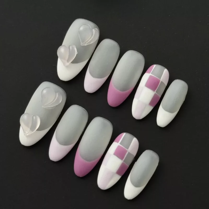 Cute mixed design press-on nails in grey, pink, and white with checkerboard and 3D heart accents – full set view