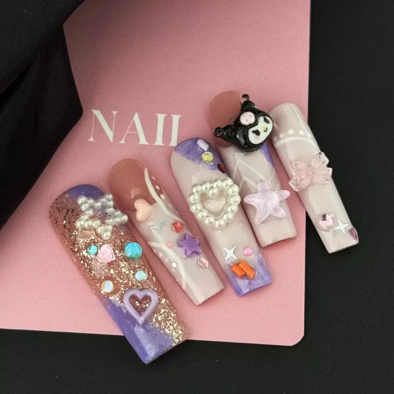 Cute cartoon press-on nails with pearls, bows, and pastel tones