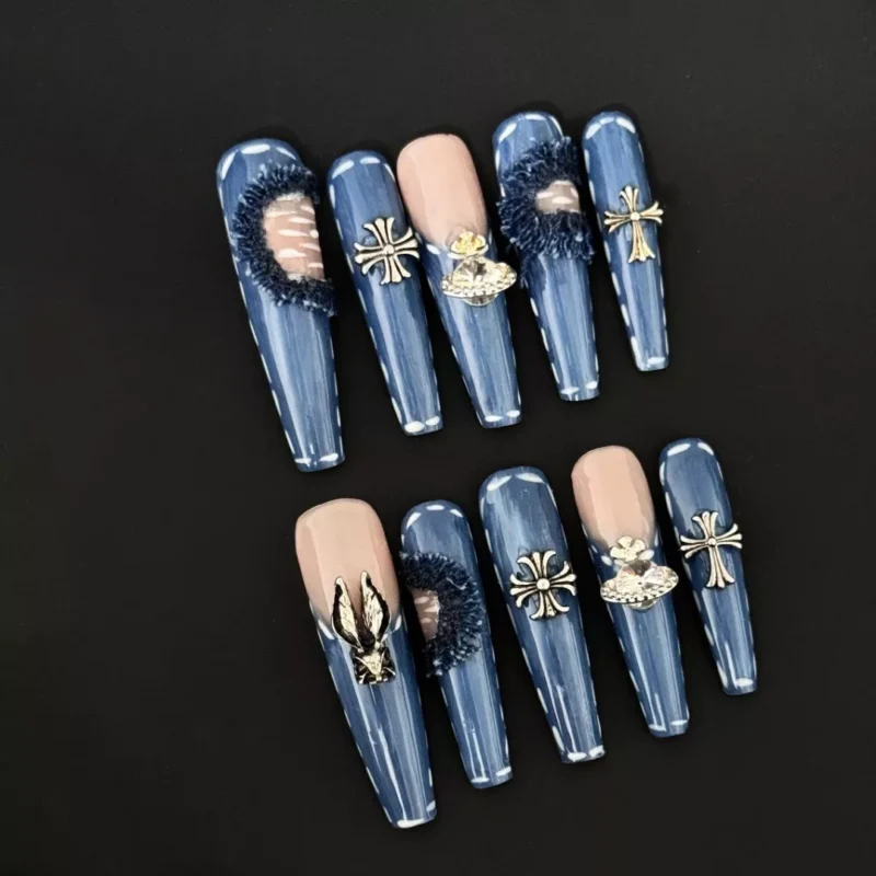 Denim Blue Press-On Nails with cross charms and silver metal studs, front view