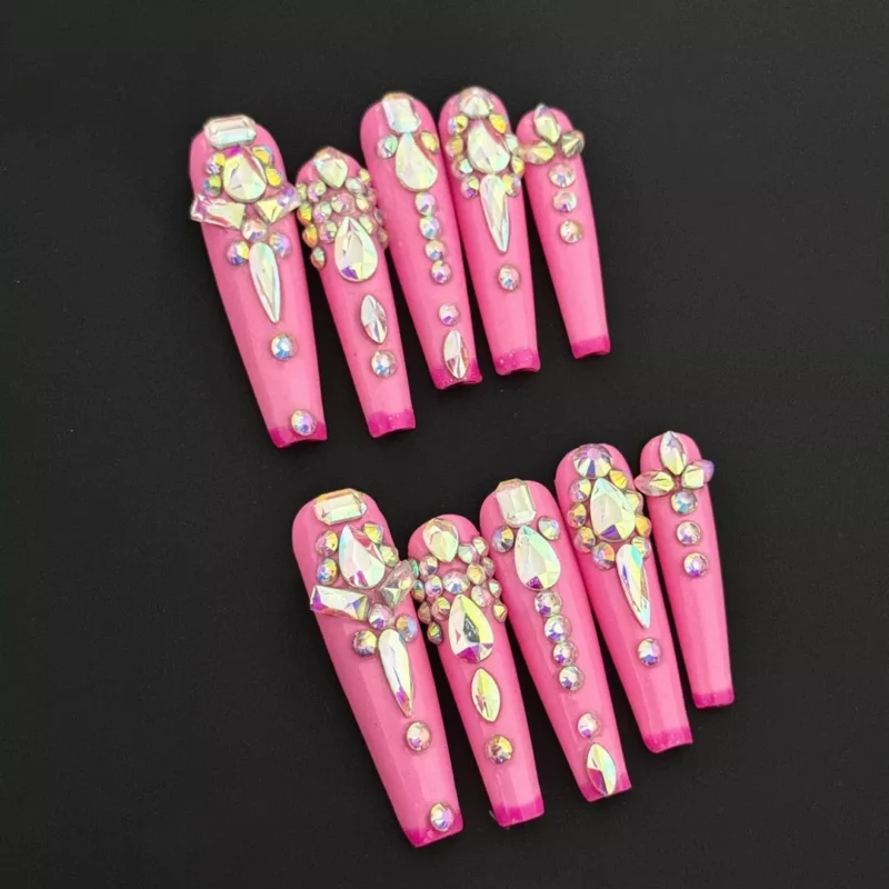 Diamond Drama Press-On Nails with hot pink base and full rhinestone design