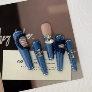 Edgy Denim Blue Press-On Nails set with cross and metallic details