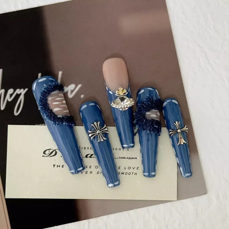 Edgy Denim Blue Press-On Nails set with cross and metallic details
