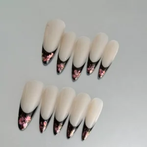 Almond-shaped press-on nails in black and nude with metallic foil