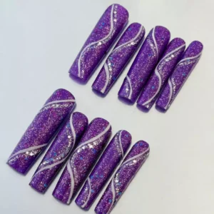 Shimmering purple glitter press-on nails with silver accents