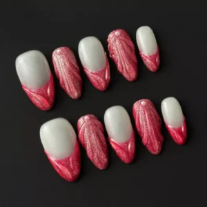 Elegant red press-on nails with textured 3D sculpting and bridal pearl decor