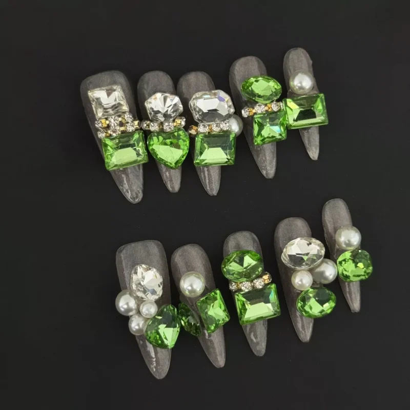emerald green press-on nails with pearl and rhinestone jewel clusters