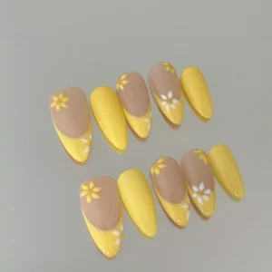 Almond yellow press-on nails with daisy floral accents