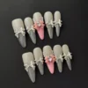 French Bow Press-On Nails - Pink Pearl Chrome 9 French Bow Press-On Nails in soft pink with 3D bows and chrome tips