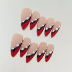 Red navy French tip press-on nails with star pattern shown under natural light