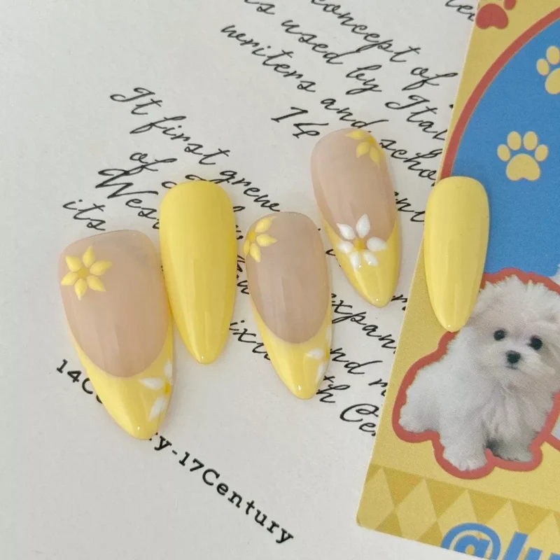 Yellow daisy floral French nails in almond shape for casual looks