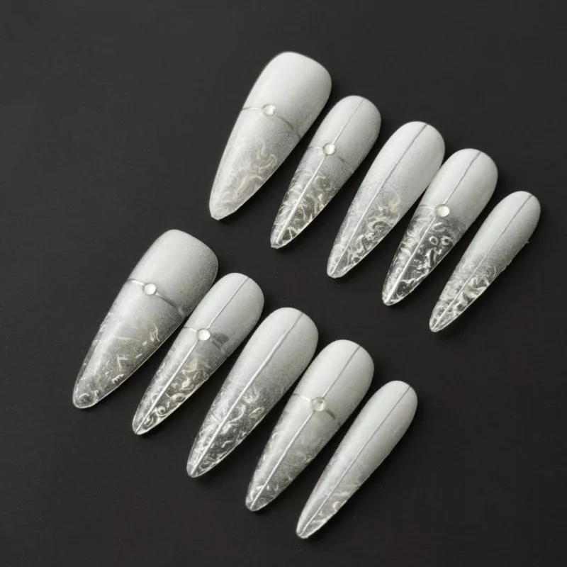 Frosted Vein Press-On Nails with metallic split design and crystal accents on black background