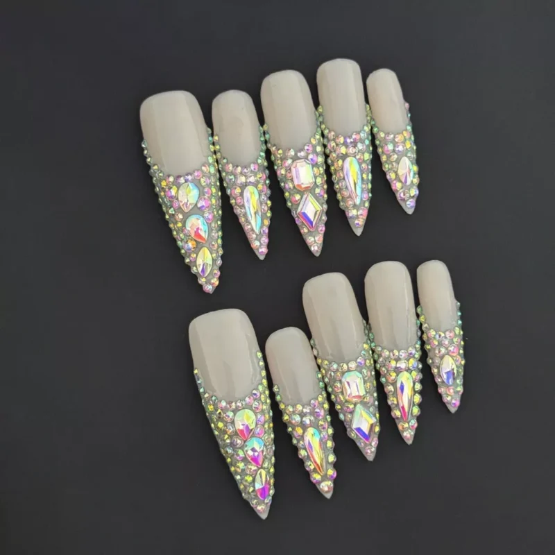 Crystal Bloom Press-On Nails with iridescent rhinestones in pyramid layout on nude stiletto base