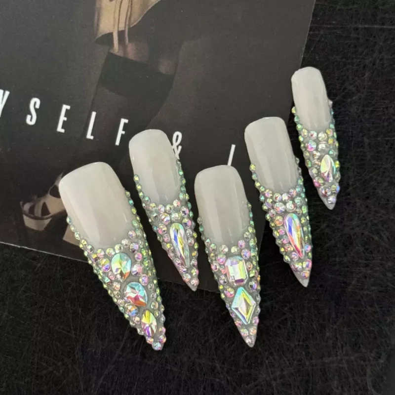 Nude stiletto press-on nails with iridescent gradient rhinestone pyramid