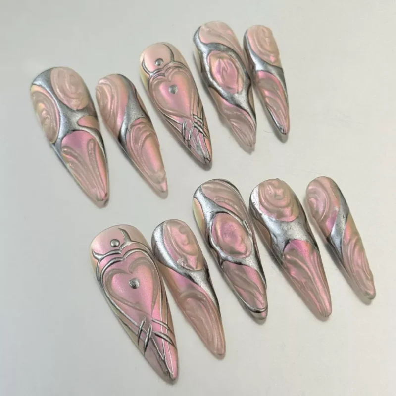 Futuristic Nail Art Designs featuring Chrome Pink and Silver Swirls