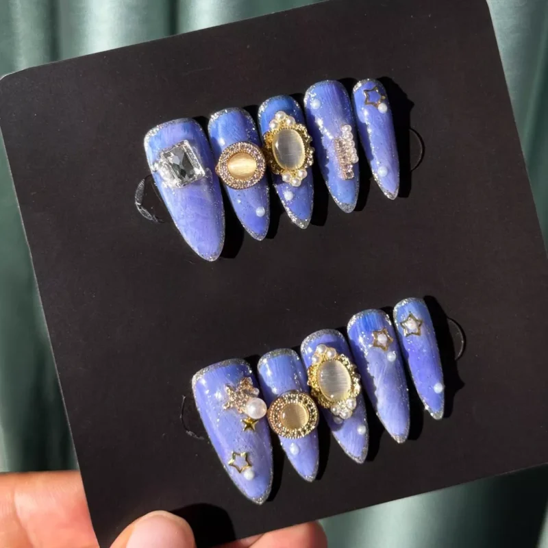 Full set of Galaxy Blue Glitter Press-On Nails in natural lighting